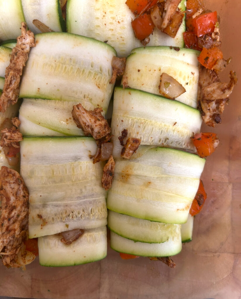 zucchini slices rolled up with enchiladas filling